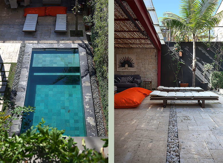 Projeto paisagístico contemporâneo com forte influência balinesa, organizado em torno de uma piscina retangular revestida com pedra hijau em tons turquesa, emoldurada por bordas em pedra natural cinza e faixas de seixos rolados que funcionam como drenagem e transição visual. A área de estar coberta com forro de bambu e estrutura metálica vermelha integra puffs laranjas, espreguiçadeiras de madeira e vegetação tropical como palmeiras e trepadeiras do tipo unha-de-gato que recobrem os muros, crian, estilo Moderno, Tropical, elementos Piscina retangular com revestimento em pedra hijau (tons de verde/turquesa), Bordas de piscina em pedra natural cinza tipo São Tomé, Espreguiçadeiras de madeira escura com almofadas brancas, Puffs/almofadões grandes na cor laranja vibrante, Sofá baixo com almofadas estampadas em preto e branco, Seixos rolados brancos e cinza como faixa drenante entre pisos, Muro pintado de preto com grafismo geométrico em cinza, Parede em pedra natural tipo canjiquinha/Moledo, Forro em esteira de bambu sob telhado aparente com estrutura vermelha, Arte decorativa na parede (quadro com figura meditativa), Vasos e jardineiras junto aos muros, plantas Palmeira-de-manila, Unha-de-gato, Pleomele, Palmeira-areca, Jabuticabeira ou árvore tropical não identificada, ambiente relaxante, sofisticado, moderno, acolhedor, localização piscina, quintal, área medio, estruturas pergolado, banco, iluminacao, cores turquesa, cinza, preto, vermelho, laranja, branco, verde, bege, piso pedra, brita, privacidade muro_verde, água piscina