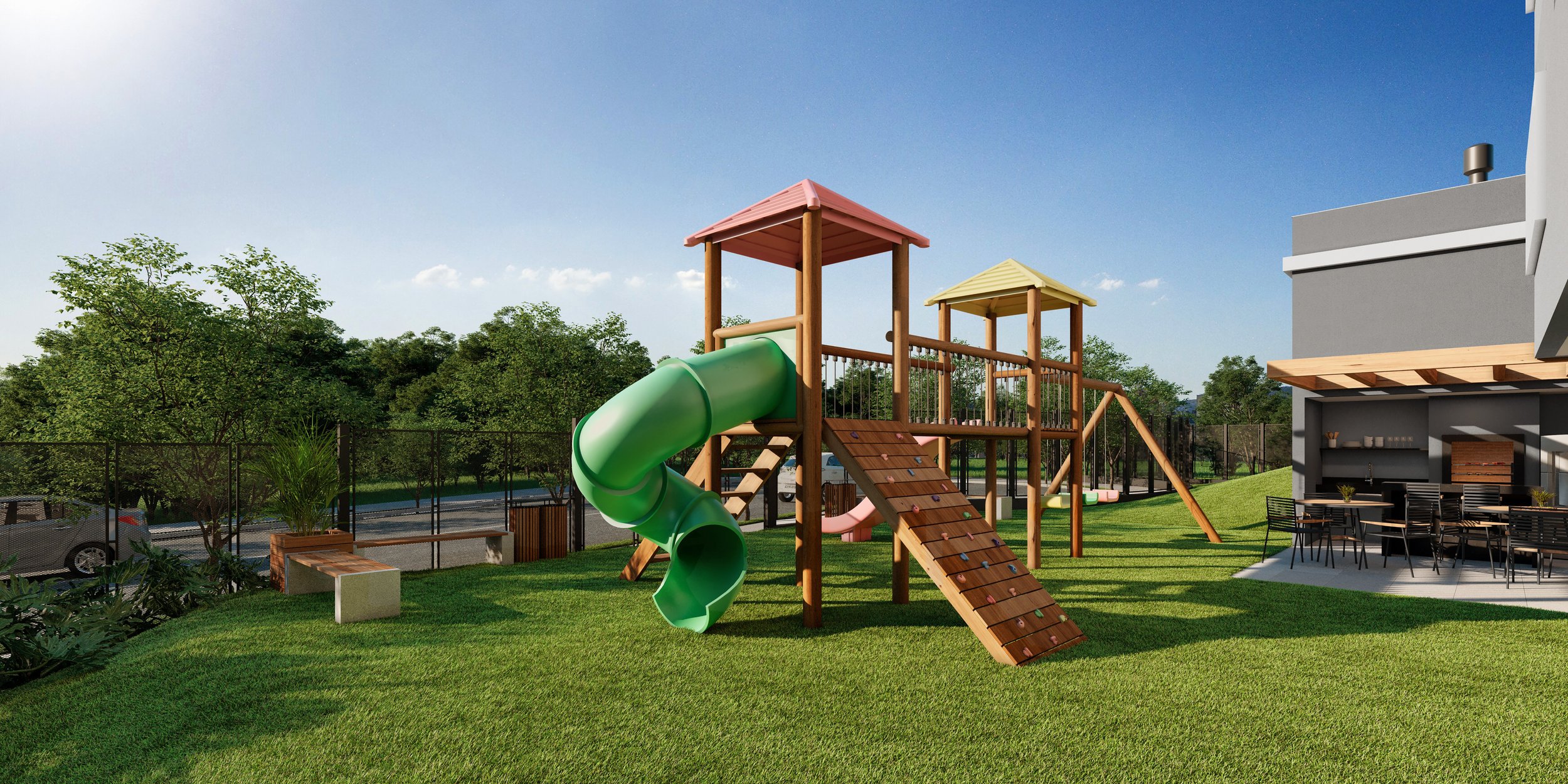 Projeto paisagístico de área de lazer condominial que integra playground infantil em madeira tratada com escorregador tubular verde, parede de escalada e duas torres cobertas sobre amplo gramado de Zoysia japonica, ladeado por maciços arbóreos tropicais compostos por Ipês, Murtas e Palmeiras-areca que formam uma cortina vegetal ao fundo junto ao alambrado perimetral. A área gourmet sob pergolado de madeira com churrasqueira em alvenaria e mobiliário preto complementa o espaço, enquanto canteiros, estilo Moderno, Tropical, elementos Playground infantil de madeira com escorregador tubular verde, Torre com telhado rosa e torre com telhado amarelo, Parede de escalada infantil em madeira com agarras coloridas, Banco de concreto e madeira em formato linear, Cerca/alambrado metálico preto perimetral, Pergolado de madeira junto à edificação, Área gourmet coberta com churrasqueira e mesas com cadeiras pretas, Jardim de bordadura com plantas ornamentais junto ao alambrado, Iluminação de parede tipo arandela no edifício, plantas Grama Esmeralda, Palmeira-areca, Ipê-mirim, Murta, Pata-de-vaca, Jabuticabeira, Moréia, Liriope, Helicônia, Dracena, ambiente acolhedor, moderno, relaxante, localização quintal, jardim, área medio, estruturas pergolado, churrasqueira, banco, iluminacao, cores verde intenso, marrom madeira, verde escuro (escorregador tubular), rosa (telhado torre principal), amarelo (telhado torre secundária), cinza (concreto e fachada), preto (alambrado e mobiliário), piso grama, porcelanato, privacidade cerca_viva, água nenhum